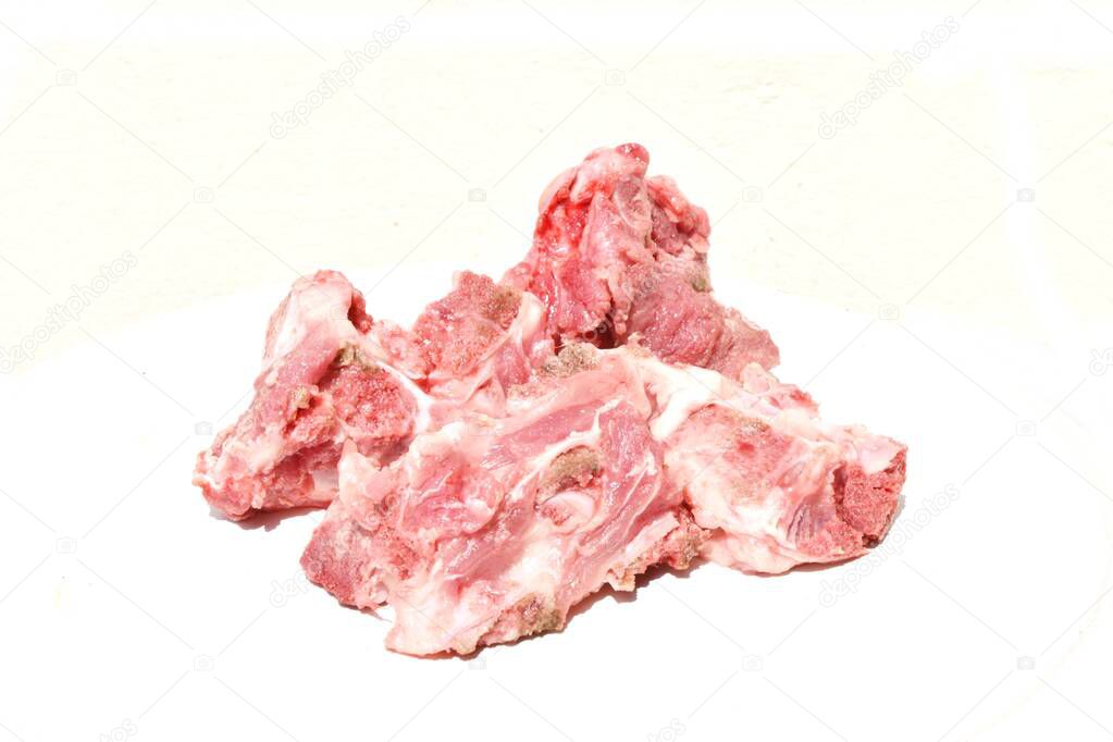 Raw pork spine on a white background, Meat and bones for soup cooking