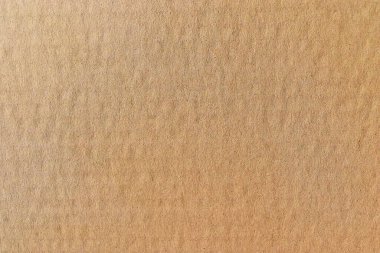 Kağıt kutu ya da mukavva, metin ya da grafik tasarımı için arkaplan ve doku, etrafa saçılmış küçük kahverengi tümseklerle yüzey boş ecru