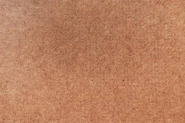 Kahverengi karton kutu veya karton, boş ecru yüzeyi, metin veya grafik tasarımı için boş notla arkaplan ve doku