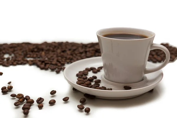 Una taza de café sobre un fondo blanco — Foto de Stock