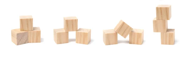 Drei Geometrische Holzwürfelblöcke Werden Auf Unterschiedliche Weise Gestapelt Isoliert Auf — Stockfoto