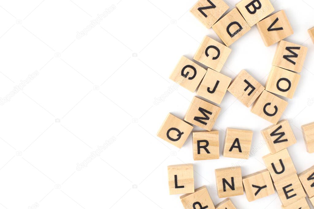 Top view the distribution of letters on wooden tiles scraped in a square shape Isolated on white background. with copy space