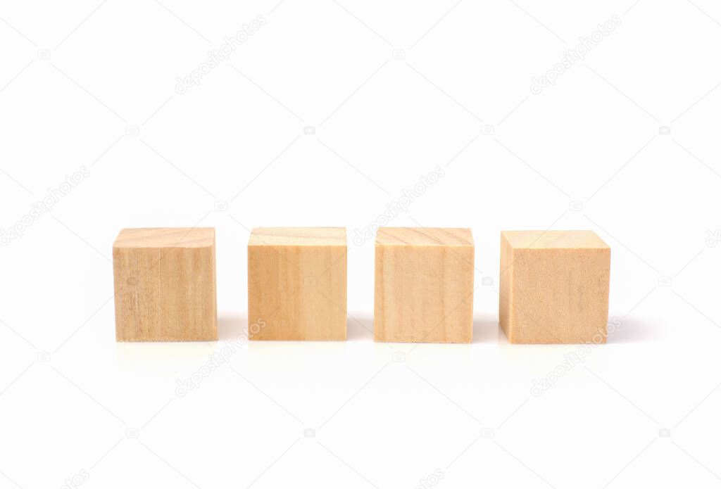four empty geometric wooden cube blocks isolated on a white background.