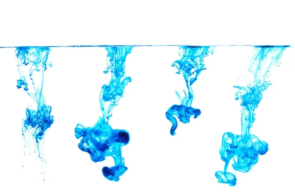 Koleksi Tinta Biru Mengalir Dalam Air Terisolasi Pada Latar Belakang — Stok Foto