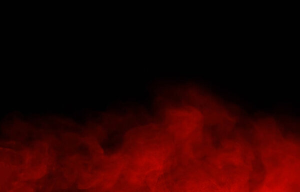 Abstract close-up of colorful red mist or steam smoke. isolated on black background in mysterious darkness copy space
