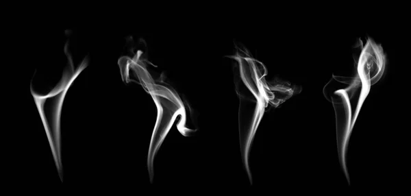 白煙群のコレクション渦巻く動き 抽象的な線黒の背景に孤立 — ストック写真