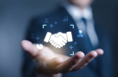 İş adamı el sıkışma ikonu, ortaklığı temsil eden, güven, işbirliği, anlaşma, takım çalışması, kurumsal ilişki ve modern pazarlamada başarılı iş anlaşması.