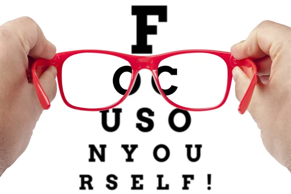 Focusing on yourself arranged as eye chart test — Stock Photo, Image