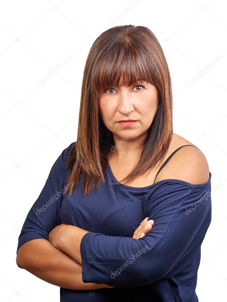 Brunette woman angry with crossed arms isolated on white