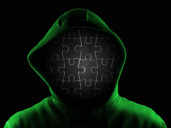 Anonymous person with face made of black jigsaw isolated on black background. Incognito mystery identikit man woman wearing hoodie