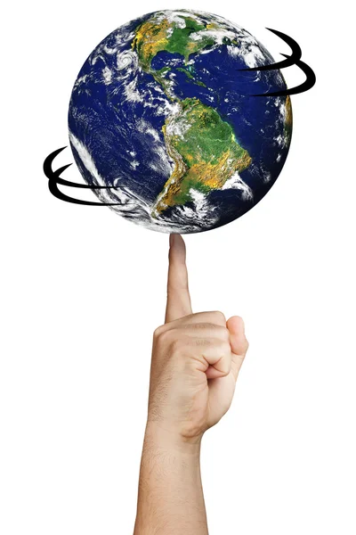 地球世界旋转分离的手指上。由美国国家航空航天局提供的地球图像 — 图库照片