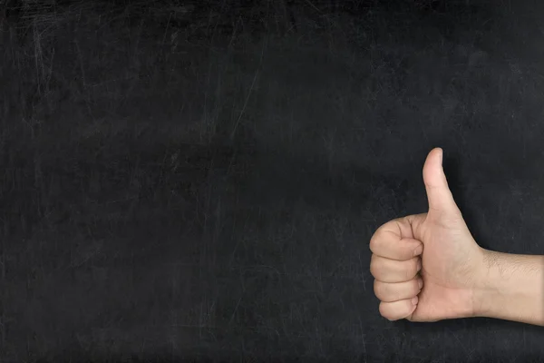 Masculino mão polegar até no usado branco blackboard — Fotografia de Stock