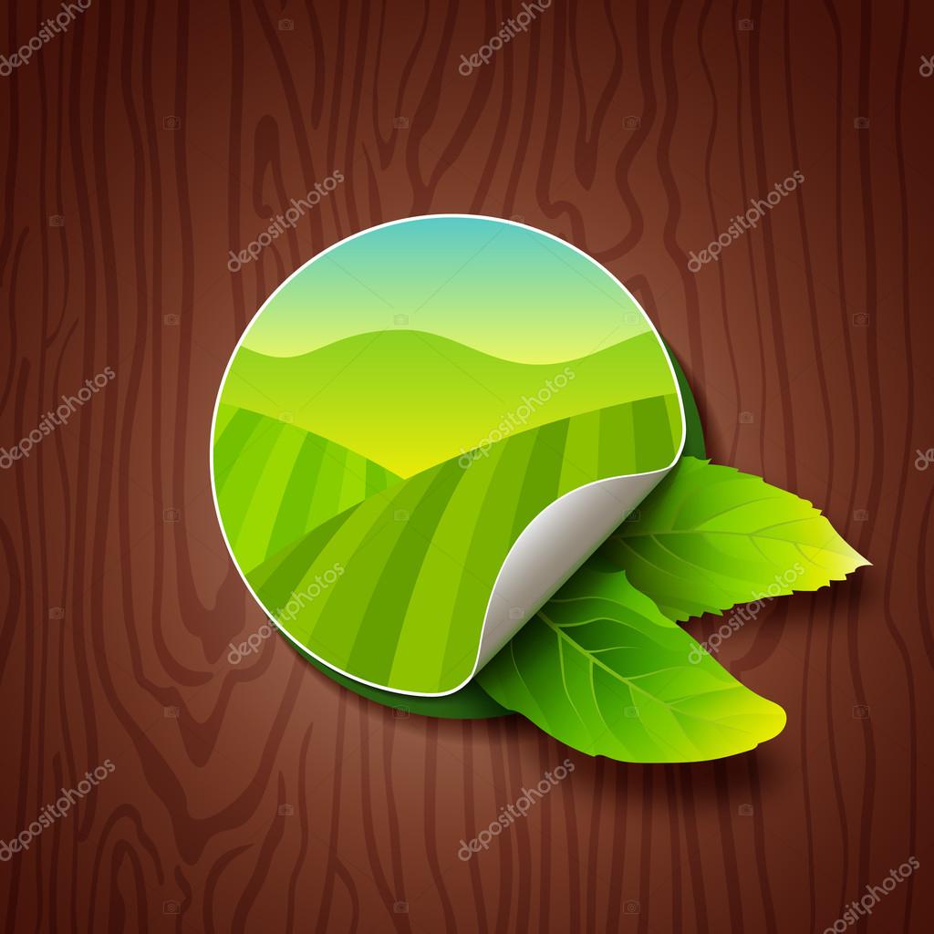 Circle Label with Green Fields, Mountains and Two Tea Leaves on Wood Background. Tea Garden on Hills Illustration. Colorful Sticker for Packaging, Logo and Web Design