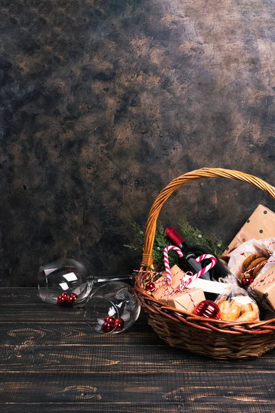 Bottle of red wine in Christmas basket. — Stock Photo, Image
