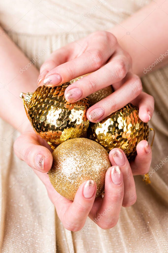 Female hands holding Christmas fir tree ornaments