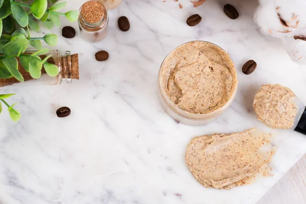 Natural body coffee scrub on marble background