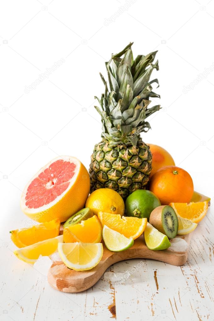 Selection of tropical fruits on white background