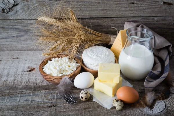 Selection of dairy products on rustic wood bacground — Stock Photo, Image