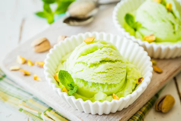 Pistachio ice cream in white bowl — Stock Photo, Image