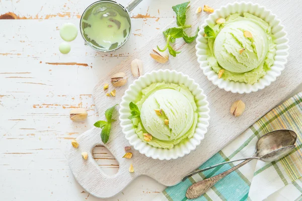 Pistachio ice cream in white bowl