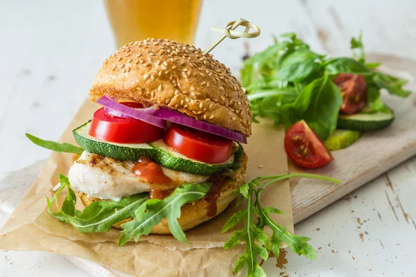 Chicken grill burger on wood background — Stock Photo, Image