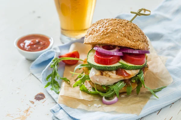 Chicken grill burger on wood background — Stock Photo, Image