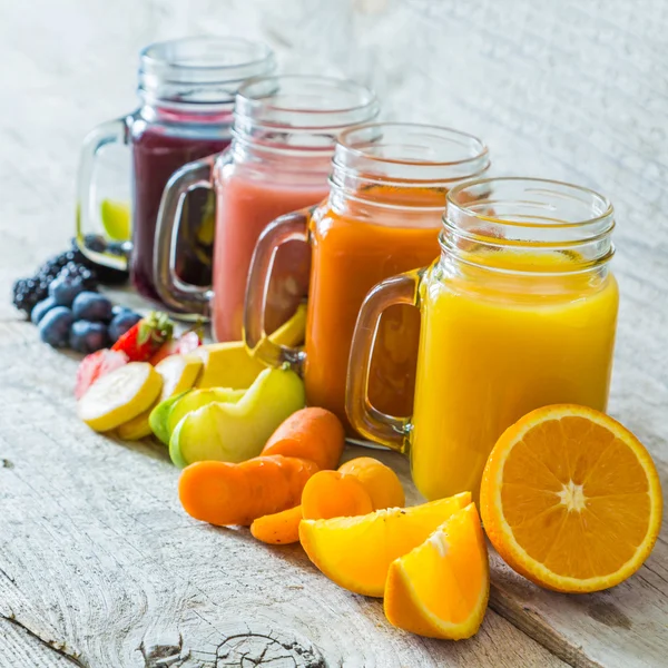 Slection of fresh fruit juices in jars — Stock Photo, Image