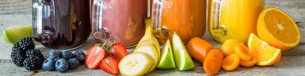 Slection of fresh fruit juices in jars — Stock Photo, Image