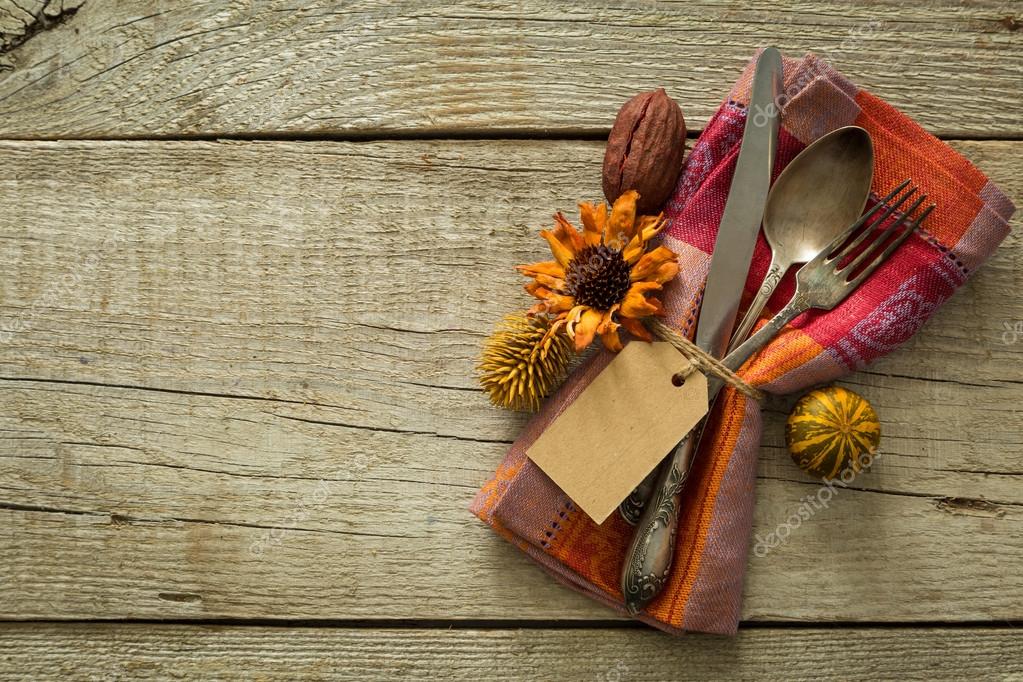Thanksgiving table setting on rustic wood background Stock Photo by
