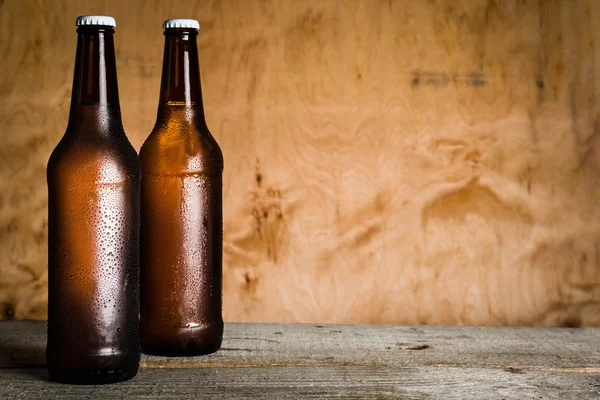 Beer in bottle with ice drops — Stock Photo, Image