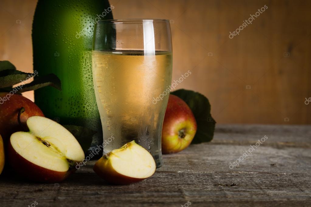 Apple cider in glass bottle with water drops — Stock Photo © anaumenko