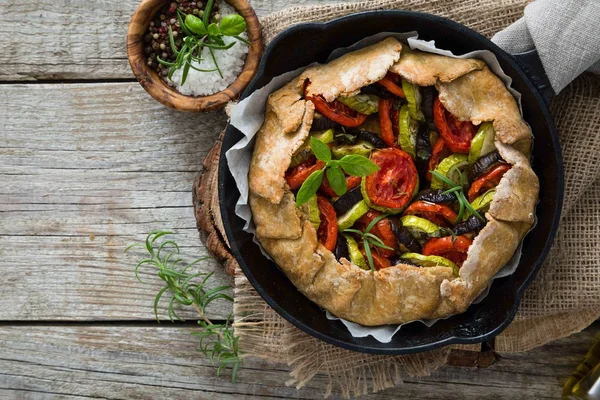 Ratatouille galette pie on rustic background — Stock Photo, Image