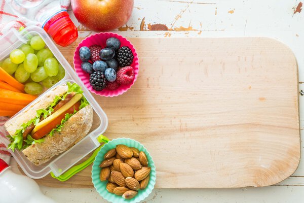 Making school lunch on wood background