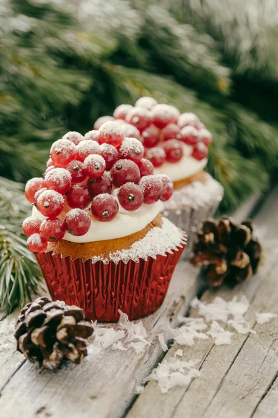 Noel cupcakeon rustik arka plan — Stok fotoğraf