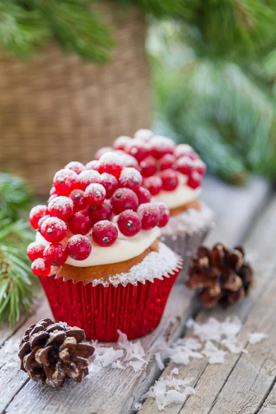 Noel cupcakeon rustik arka plan — Stok fotoğraf