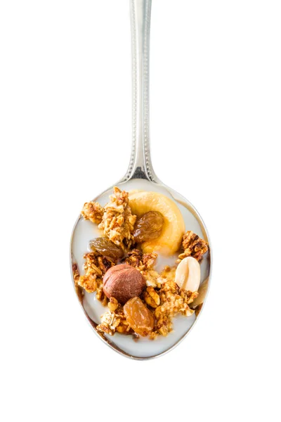 Granola in spoon with nuts — Stock Photo, Image