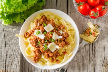 Spaghetti bolognese with cheese clipart