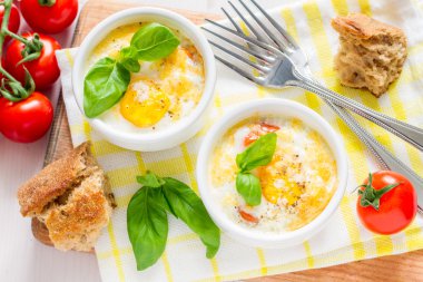 Egg cocotte in ramekins with bread clipart