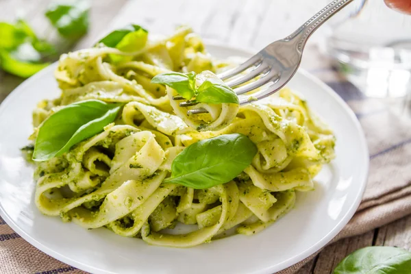 Tagliatelle pasta with pesto sauce — Stock Photo, Image