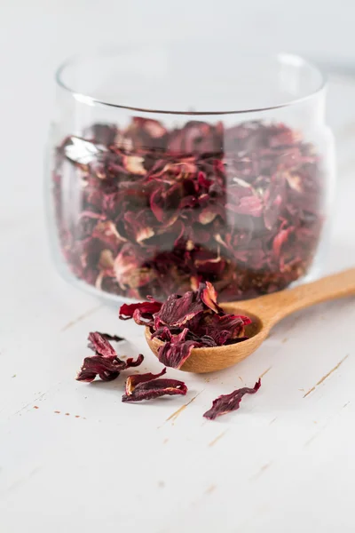 Dry hibiscus tea in glass jar — Stock Photo, Image