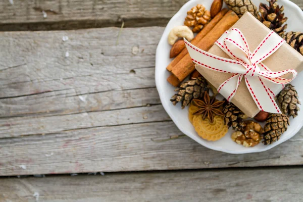 Preasent nuts cinnamon ribbon — Stock Photo, Image