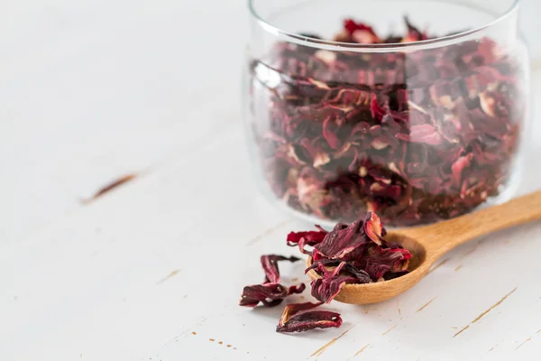 Dry hibiscus tea in glass jar — Stock Photo, Image