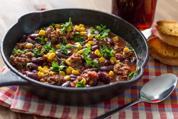 Chili con carne in iron cast — Stock Image Chili con carne in iron cast Stock Image