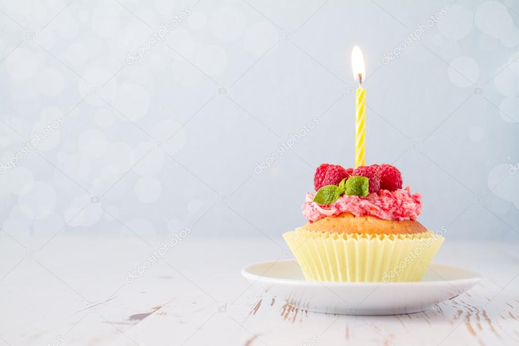 Birthday cupcake with raspberry and candy