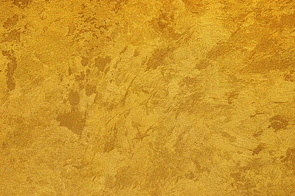 Texture of golden decorative plaster or concrete. Abstract grunge background for design.