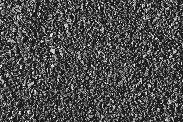 Close-up of black activated carbon texture. Coconut charcoal.