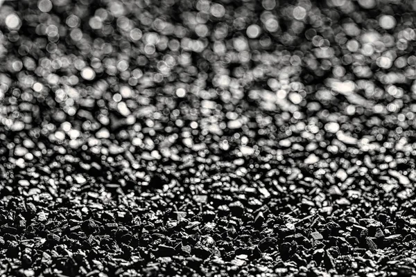 Close-up of black activated carbon texture. Coconut charcoal.