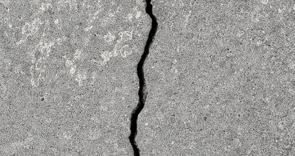 Cracked texture of gray concrete. Abstract background for design.