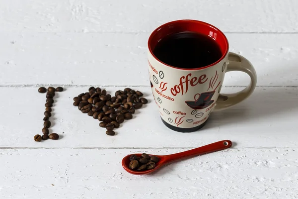 Coffee cup on a white wooden table — Stock Photo, Image