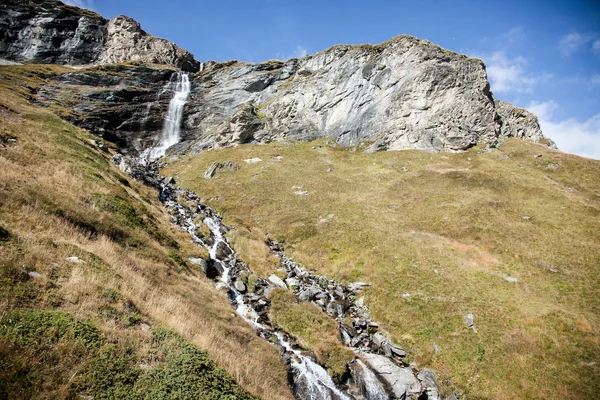 Waterfall on the Italian side of the Matterhorn (Cervino in Italian) viewed from the city of Breuil-Cervinia, Aosta region, Italy